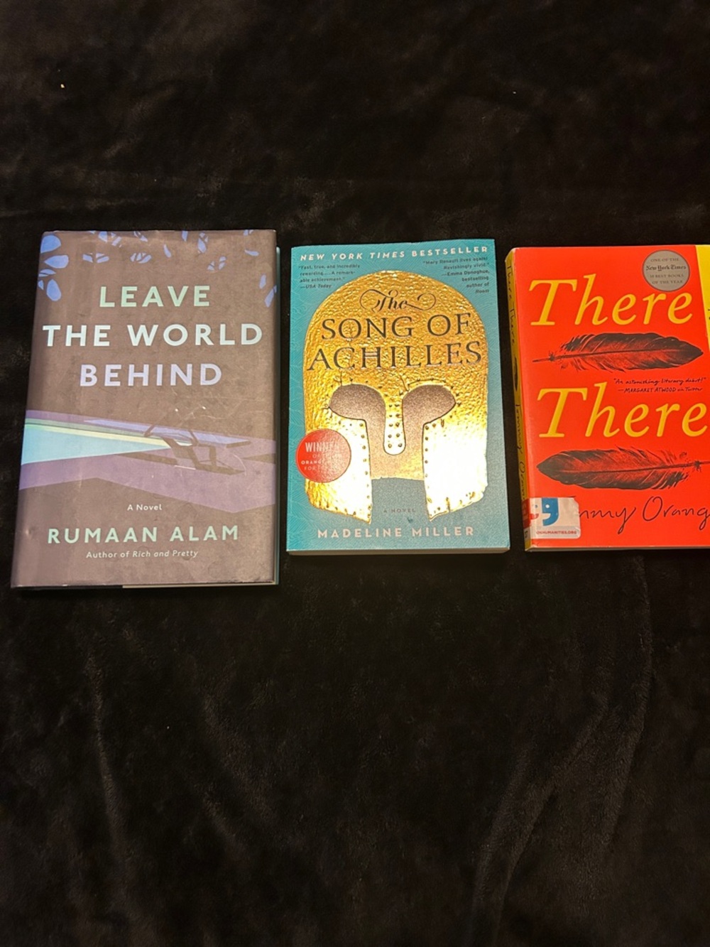 Set of 3 books. One hardcover two soft.
